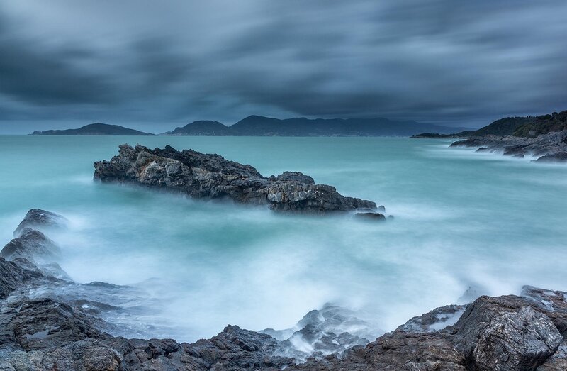Rocky Coastline at Sea — Blue, Dramatic, Photograph