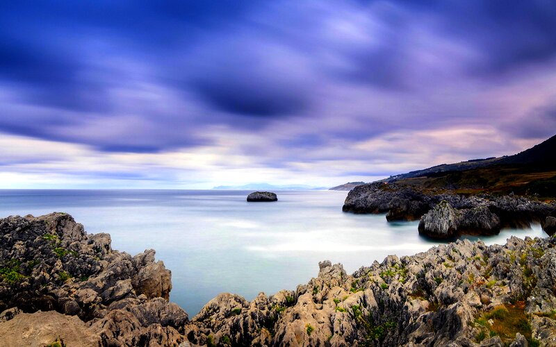 Rocky Coastline at Sea — Blue, Dramatic, Sunset
