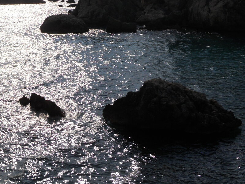 Rocky Coastline at Sea — Blue, Serene, Afternoon, Photograph, Rocks