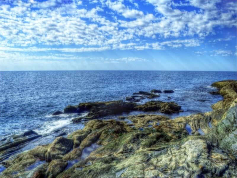 Rocky Coastline at Sea — Blue, Serene, Afternoon, Photograph