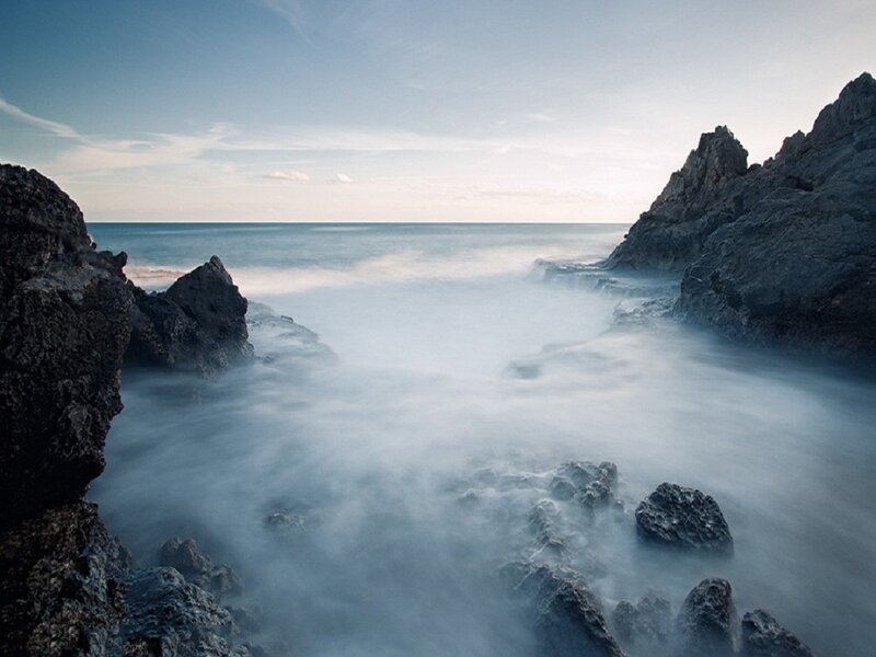 Rocky Coastline at Sea — Blue, Serene, Sunset