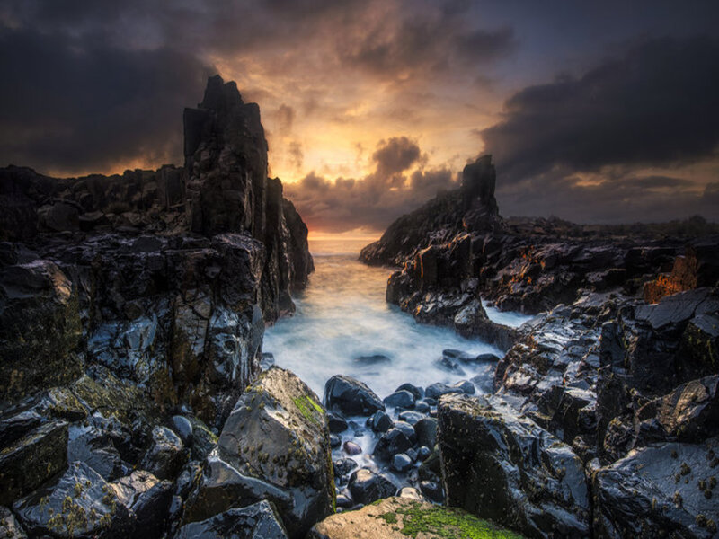 Rocky Coastline at Sunset — Black