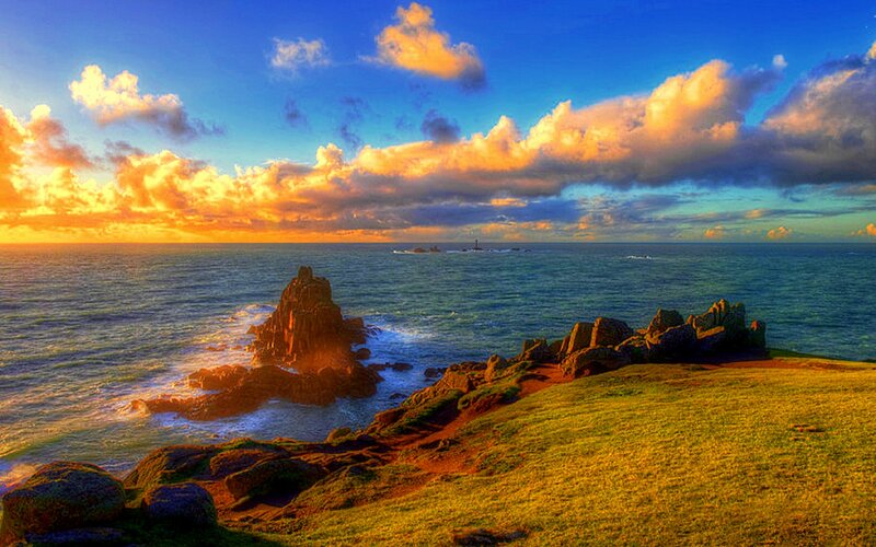 Rocky Coastline at Sunset — Blue, Dramatic, Photograph, Ocean, Clouds, Lighthouse