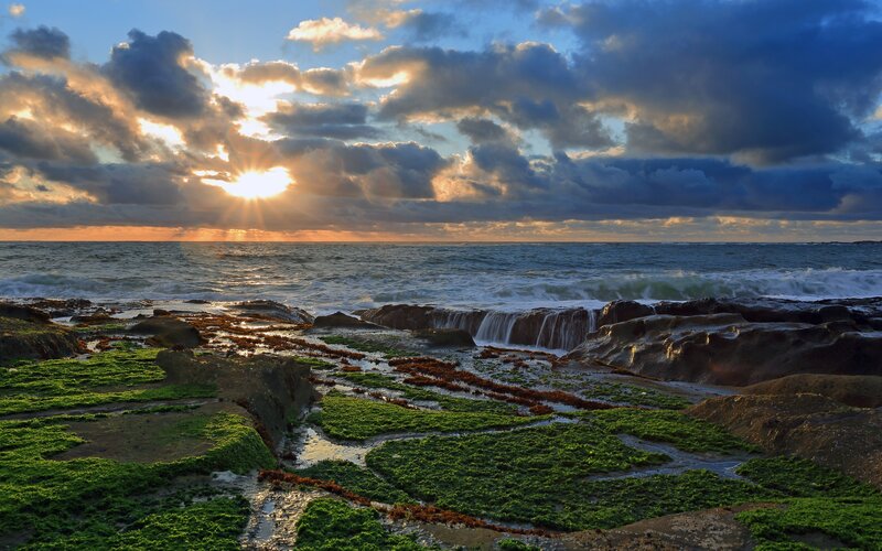 Rocky Coastline at Sunset — Blue, Dramatic, Photograph, Ocean, Clouds, Sun