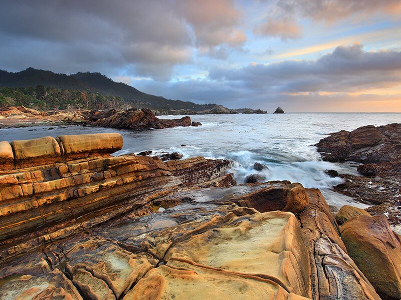 Rocky Coastline at Sunset — Blue, Dramatic, Photograph, Ocean, Mountain, Clouds