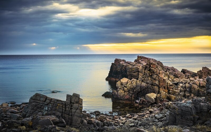 Rocky Coastline at Sunset — Blue, Dramatic, Photograph, Ocean, Rocks, Clouds, Yellow