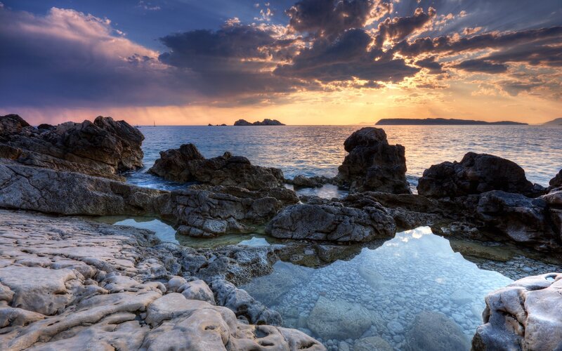 Rocky Coastline at Sunset — Blue, Dramatic, Photograph, Ocean, Sky, Rocks, Clouds