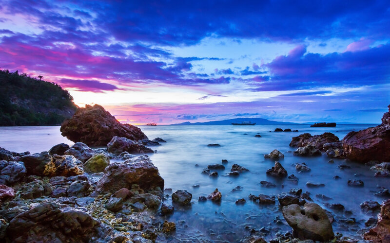 Rocky Coastline at Sunset — Blue, Dramatic, Photograph, Rocks, Sea, Sky, Boat