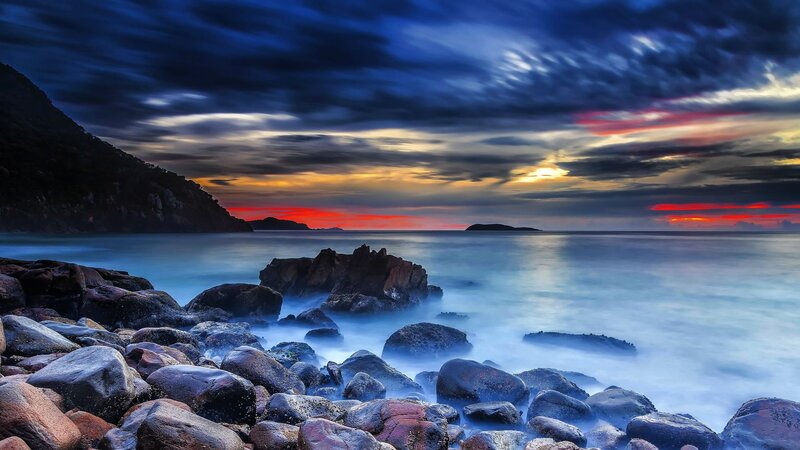 Rocky Coastline at Sunset — Blue, Dramatic, Photograph, Rocks, Sea, Sky, Mountain