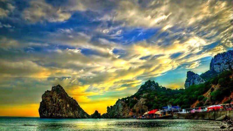 Rocky Coastline at Sunset — Blue, Dramatic, Photograph, Sea, Mountain, Boat