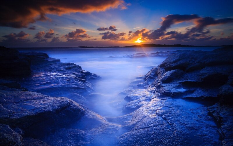 Rocky Coastline at Sunset — Blue, Dramatic, Photograph, Sun, Clouds, Ocean