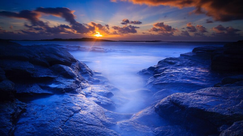 Rocky Coastline at Sunset — Blue, Dramatic, Photograph, Sun, Clouds