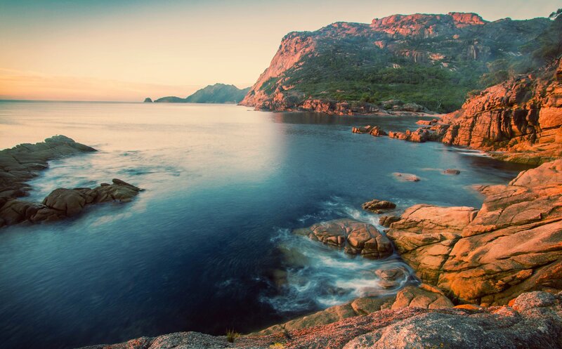 Rocky Coastline at Sunset — Blue, Serene, Photograph, Ocean, Mountain, Rocks