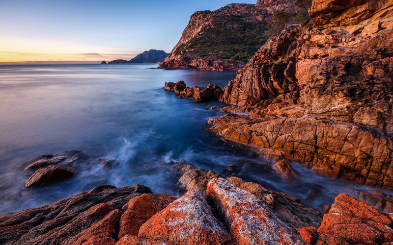 Rocky Coastline at Sunset — Blue, Serene, Photograph, Ocean, Mountain, Sky