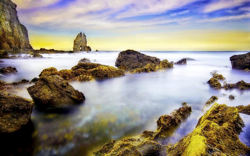 Rocky Coastline at Sunset — Blue, Serene, Photograph, Rocks, Sea