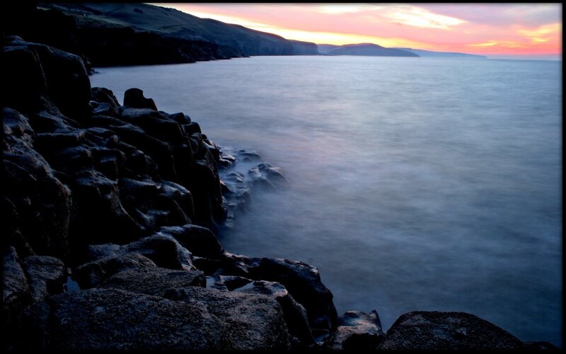 Rocky Coastline at Sunset — Blue, Serene