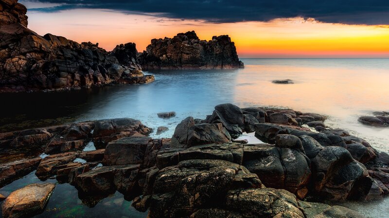 Rocky Coastline at Sunset — Dramatic, Black