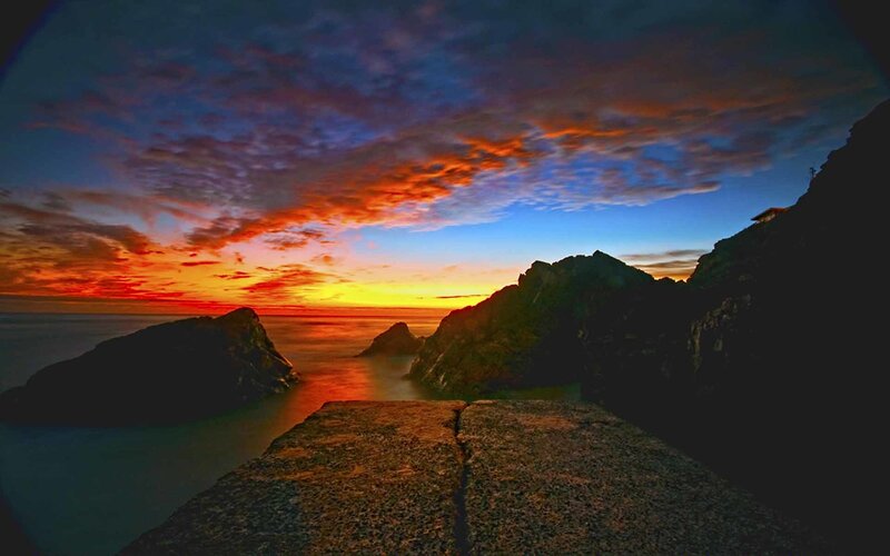 Rocky Coastline at Sunset — Dramatic, Blue