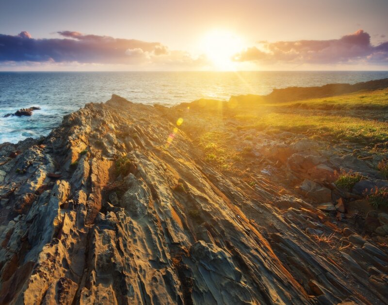 Rocky Coastline at Sunset — Gold, Serene