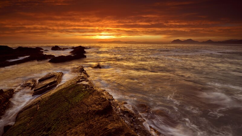 Rocky Coastline at Sunset — Orange, Dramatic, Photograph, Ocean, Sky, Mountains