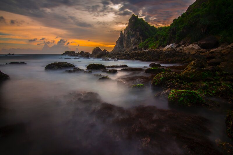 Rocky Coastline at Sunset — Orange, Dramatic, Photograph, Rocks, Sea, Sky, Vegetation