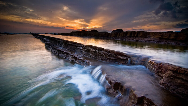 Rocky Coastline at Sunset — Orange, Dramatic, Photograph, Rocks