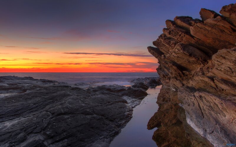 Rocky Coastline at Sunset — Orange, Serene, Photograph, Ocean, Sky