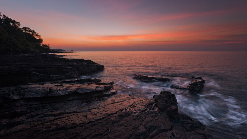 Rocky Coastline at Sunset — Orange, Serene, Photograph, Ocean, Sky, Trees