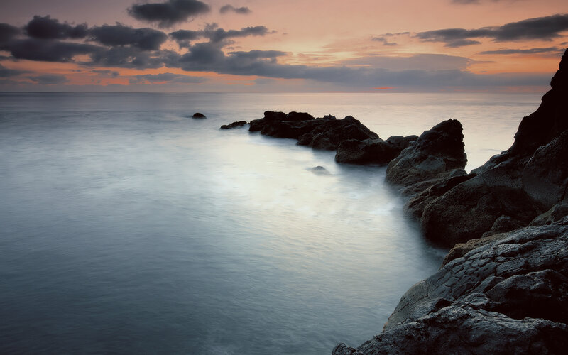 Rocky Coastline at Sunset — Orange, Serene, Photograph, Rocks, Ocean, Sky, Clouds