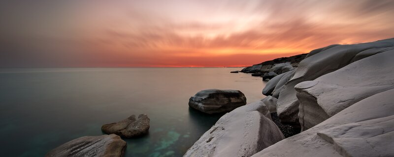 Rocky Coastline at Sunset — Orange, Serene, Photograph, Rocks, Sea, Sky, Pink