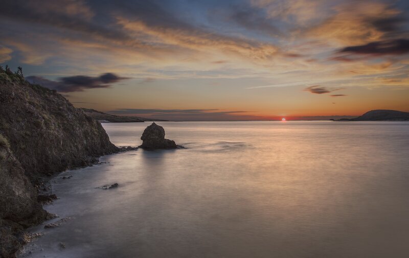 Rocky Coastline at Sunset — Orange, Serene, Photograph, Sea, Cliff