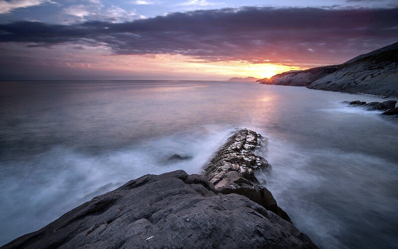 Rocky Coastline at Sunset — Purple, Dramatic, Photograph, Ocean, Sky, Mountain, Orange