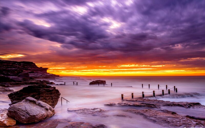 Rocky Coastline at Sunset — Purple, Dramatic, Photograph, Rocks, Ocean, Sky, Fence