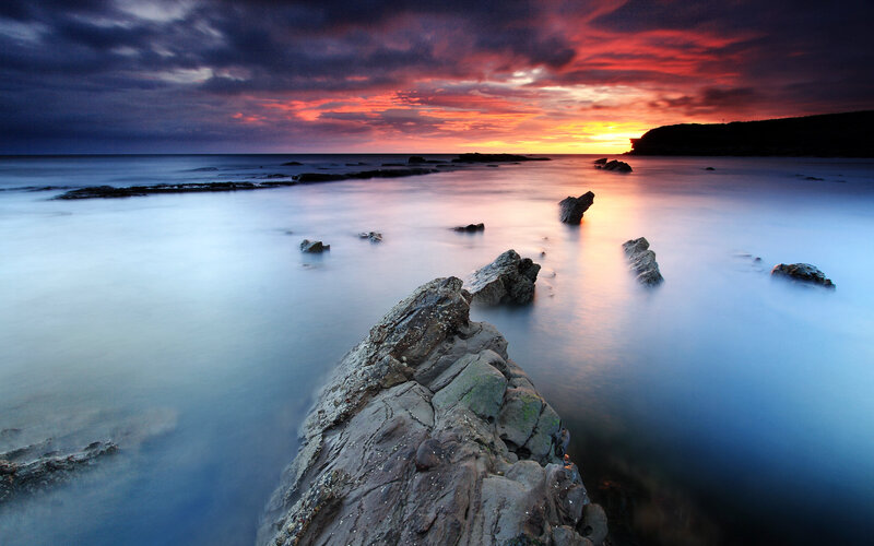 Rocky Coastline at Sunset — Red, Dramatic, Photograph, Rocks, Sea