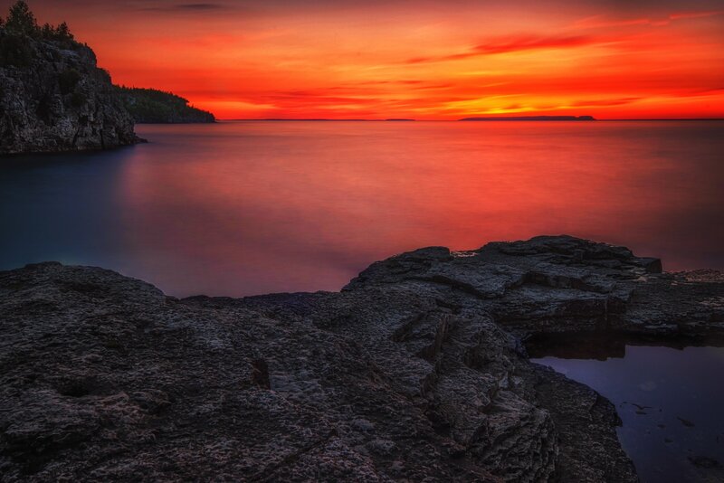 Rocky Coastline at Sunset — Red, Dramatic, Photograph, Rocks, Water