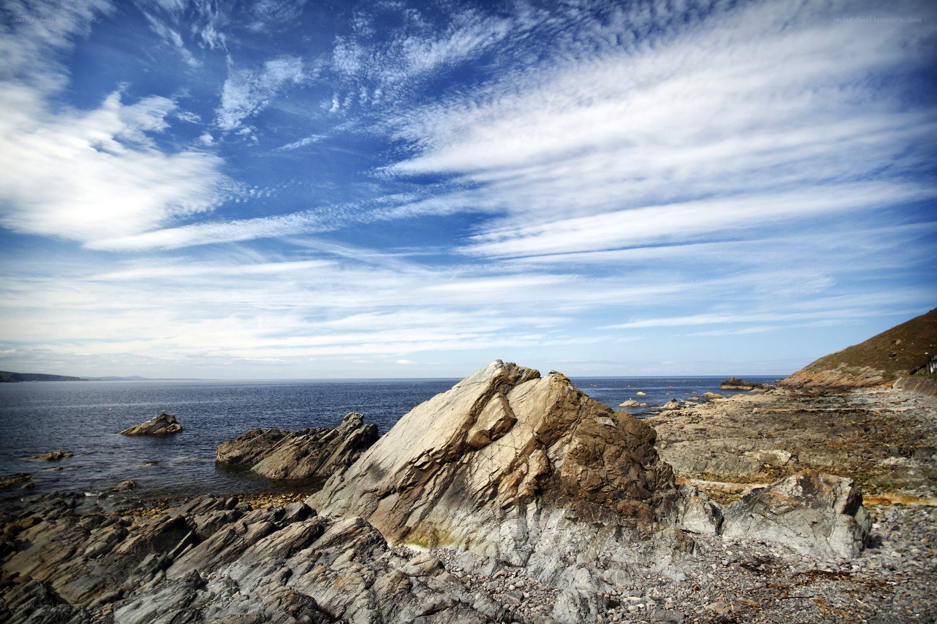Rocky coastline under blue sky