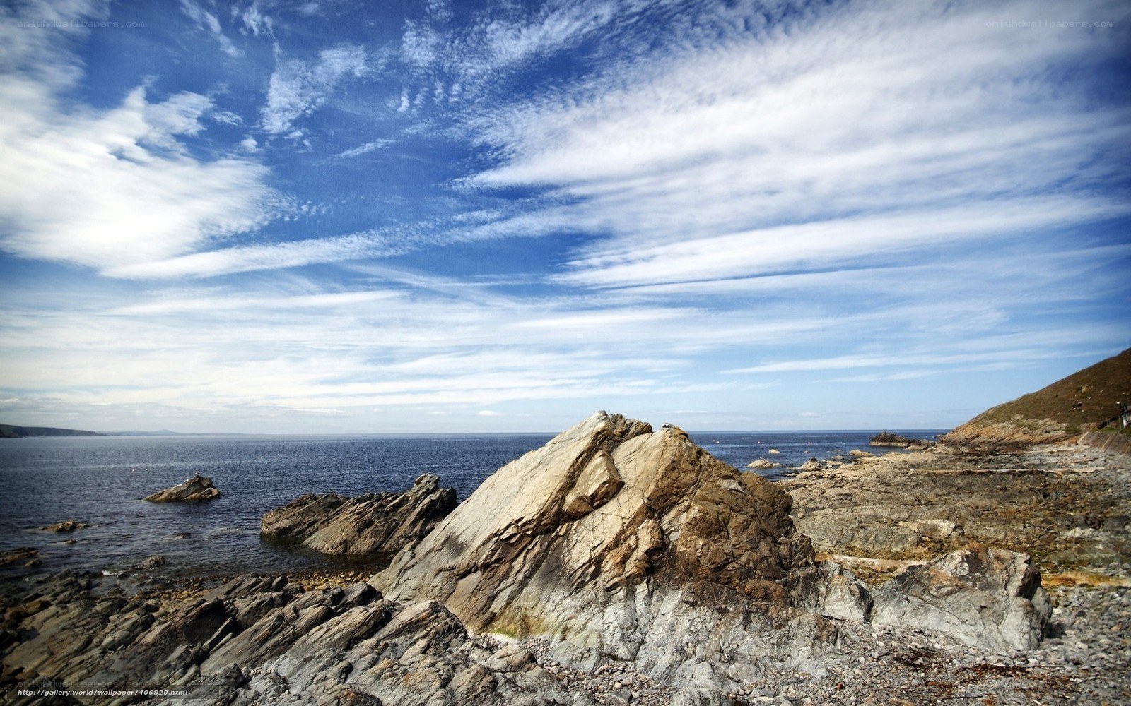 Rocky coastline under blue sky