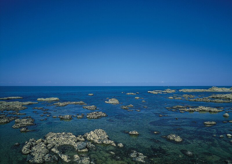 Rocky coastline under clear sky
