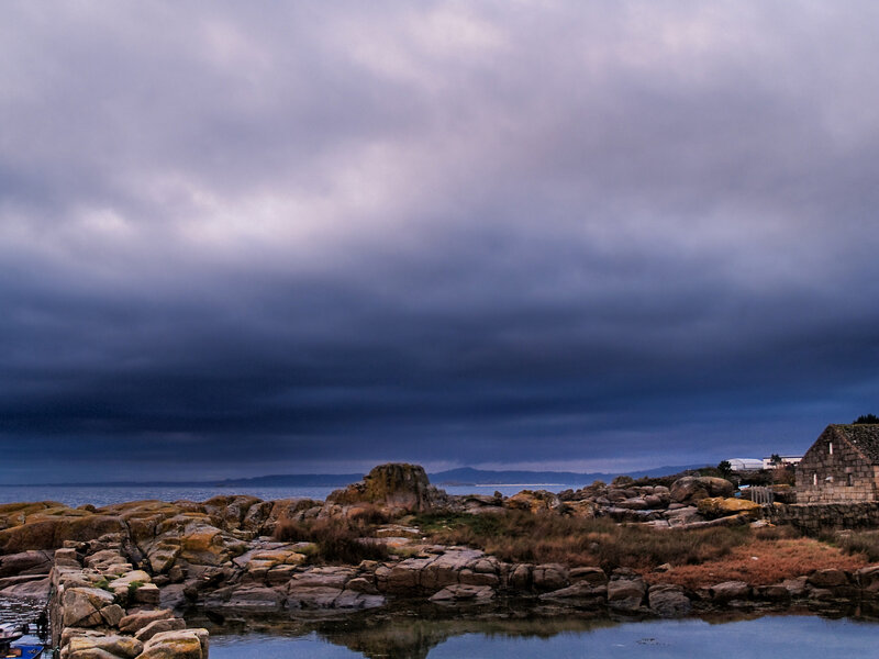 Rocky Coastline under Storm Clouds