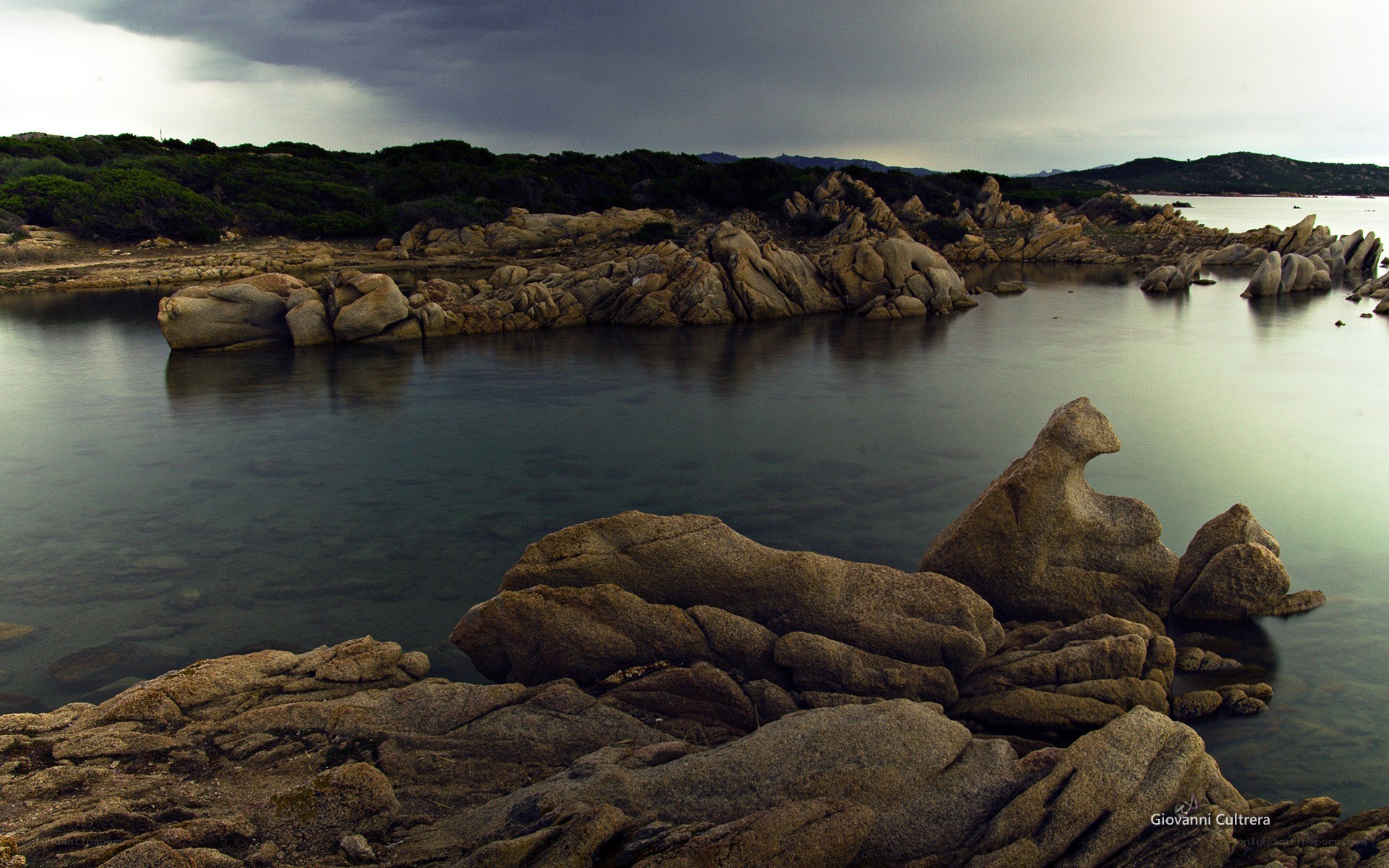 Rocky coastline under stormy sky