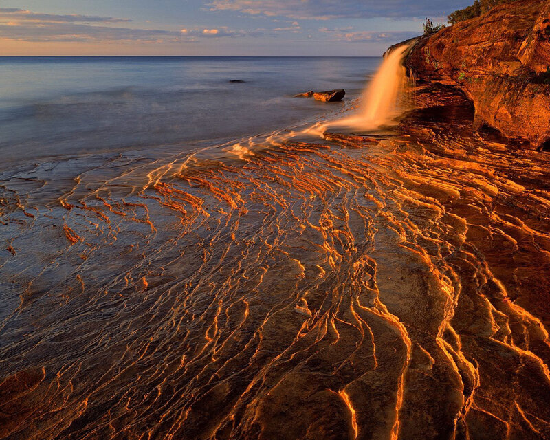 Rocky Coastline Waterfall — Orange