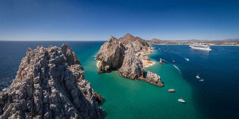 Rocky Coastline with Boats — Blue
