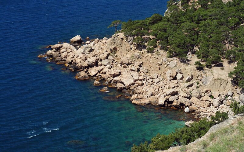 rocky coastline with clear blue water