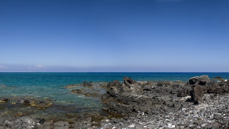 rocky coastline with clear blue water