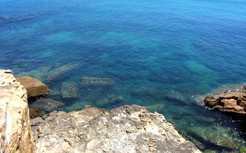 rocky coastline with clear blue water