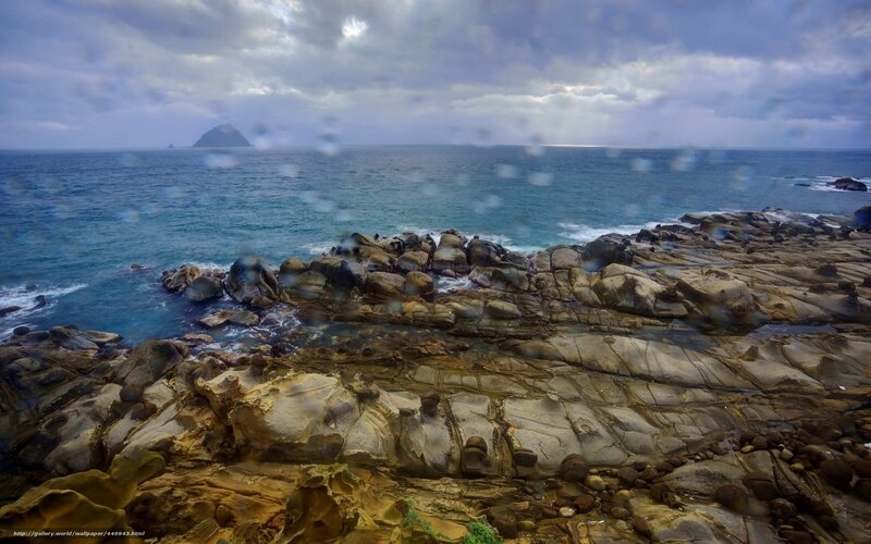 Rocky coastline with distant island