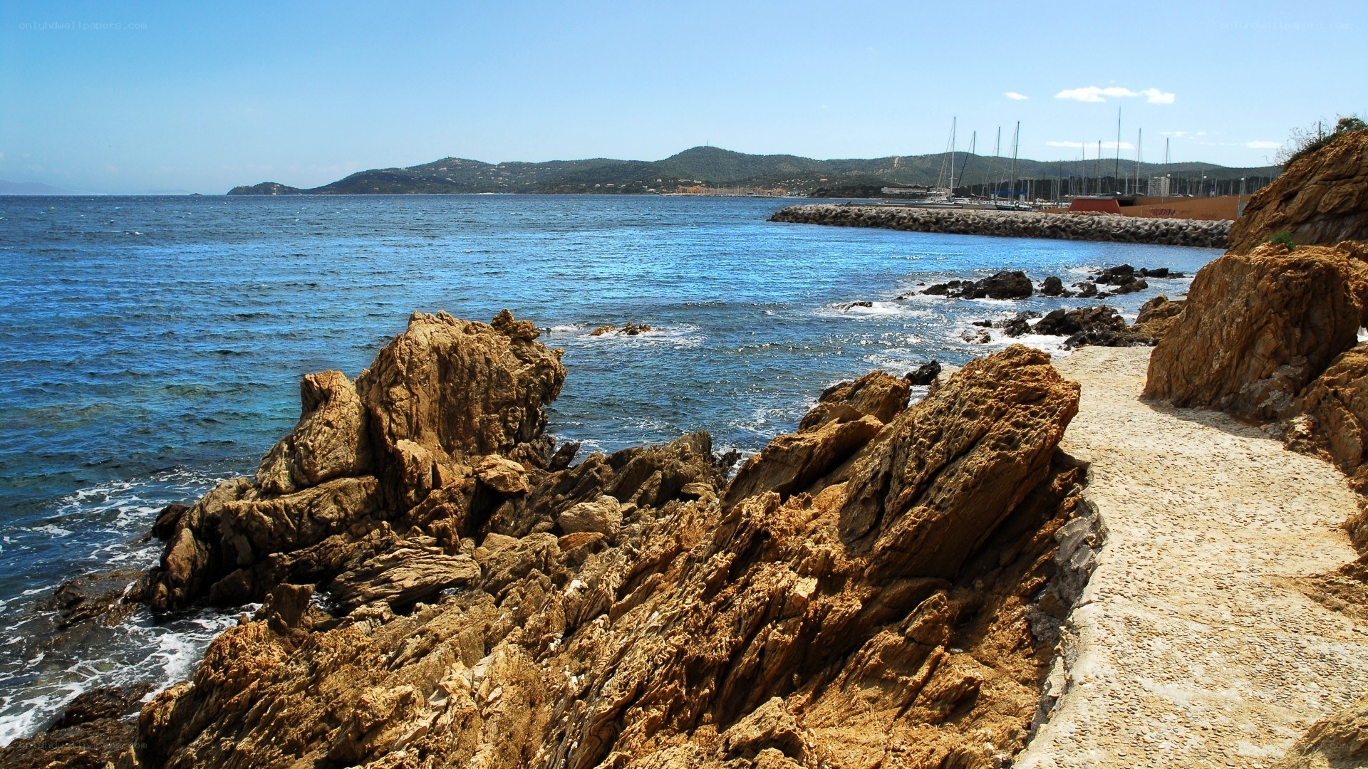 Rocky coastline with marina view