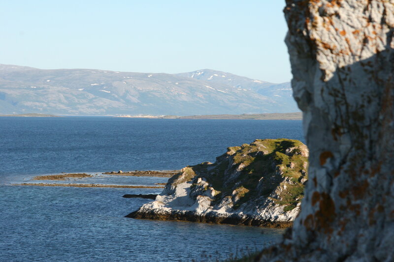 Rocky Coastline with Mountains