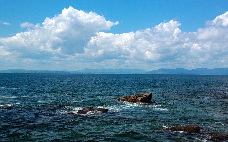 Rocky Coastline with Sea — Blue, Serene, Afternoon, Photograph, Clouds