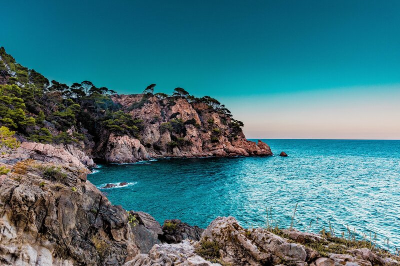Rocky Coastline with Sea — Blue, Serene, Sunset